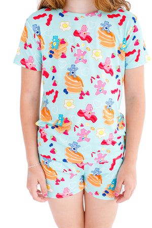 Shop Birdie Bean Care Bears™ Breakfast Bears Pancake Print 2-piece Short Sleeve Kids Pajamas with Shorts at Purple Owl Boutique