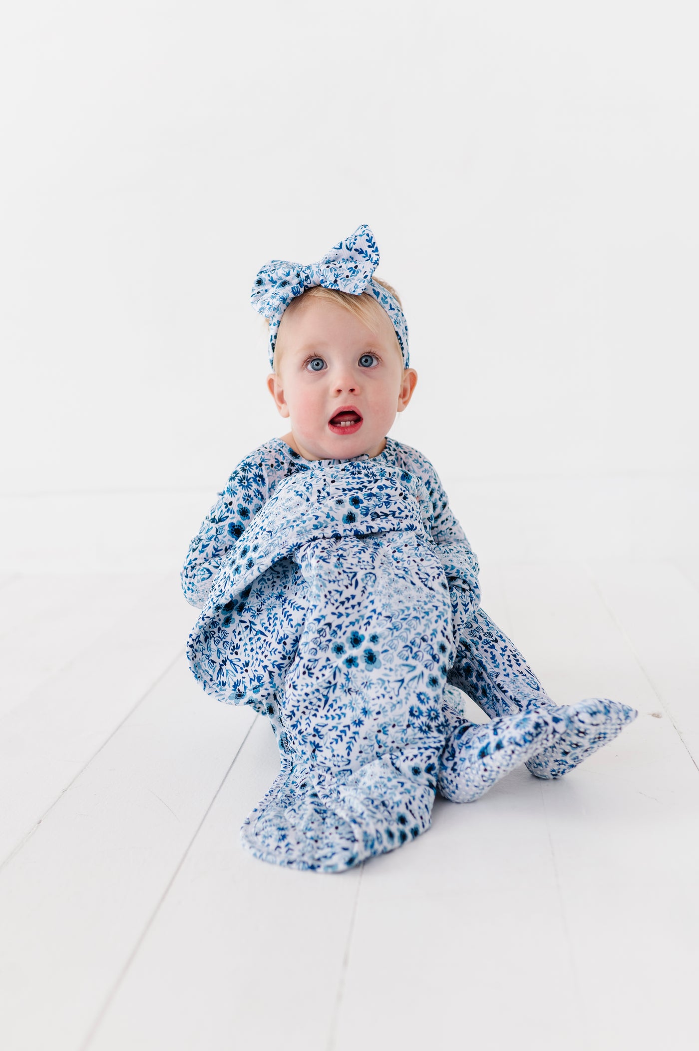 Shop The Sleepy Sloth Royal Gardens Blue Floral Ribbed Print Zip Jammies Convertible Romper at Purple Owl Boutique
